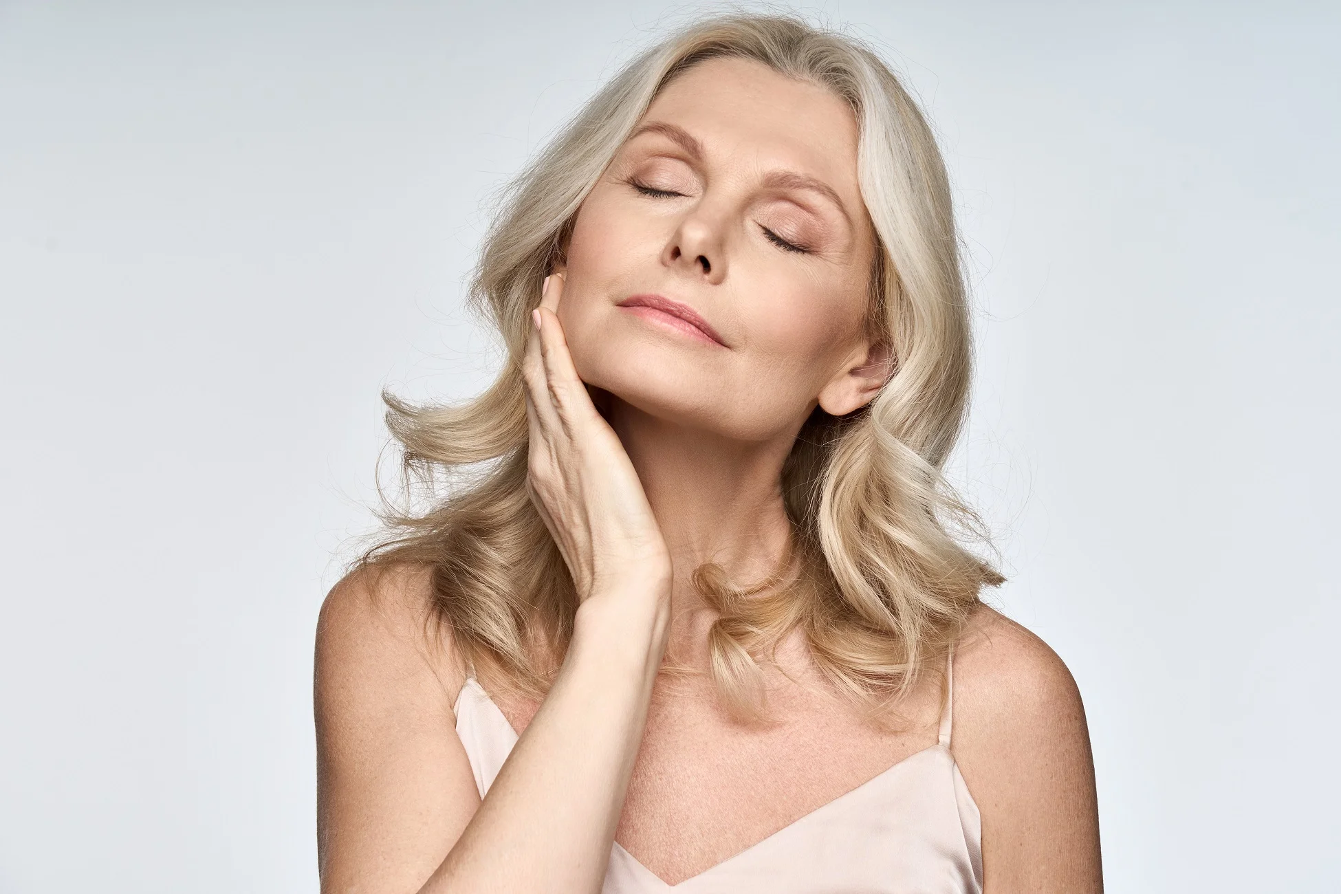 A woman with radiant skin, highlighting effective cheek and chin contouring.
