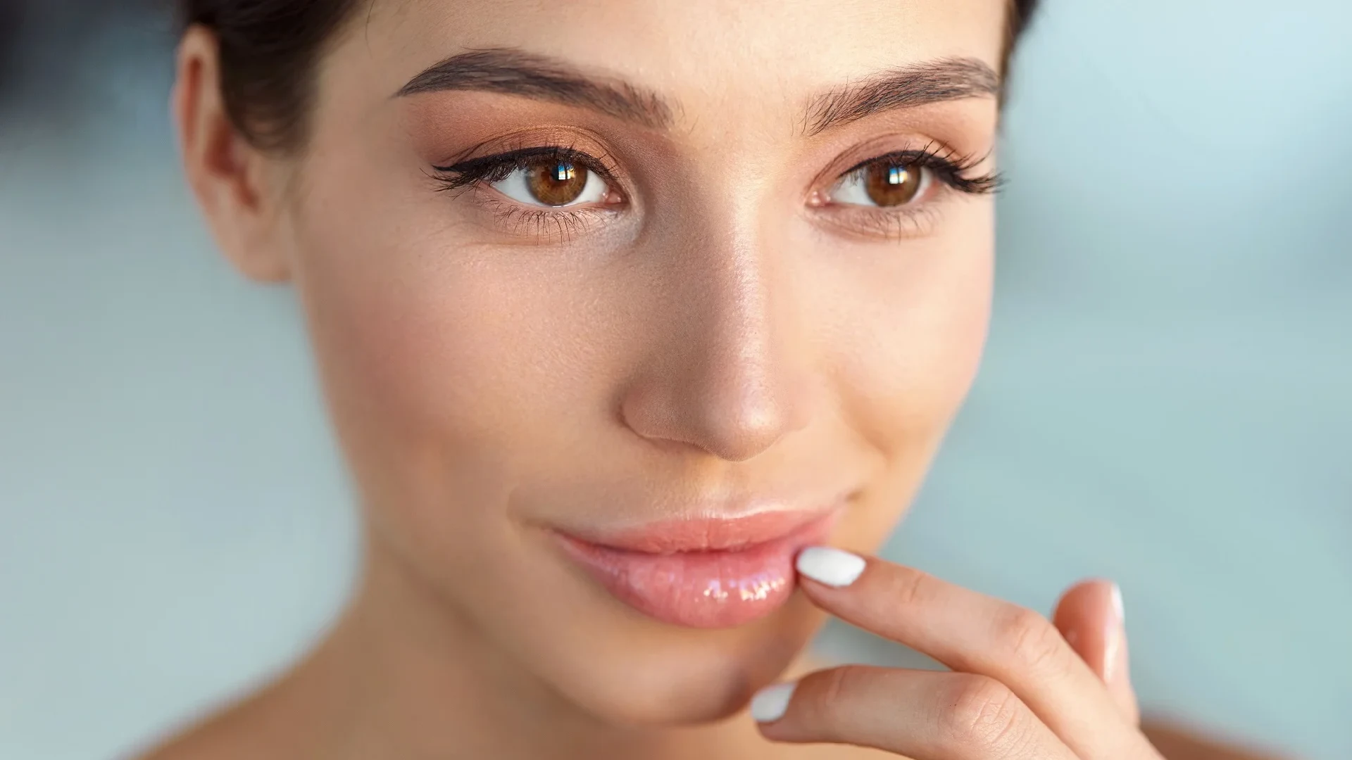 A woman with healthy, moisturized lips, indicating successful lip treatment.