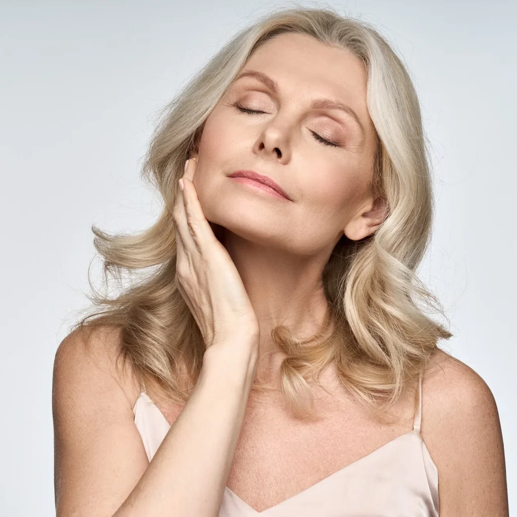 A woman with radiant skin, highlighting effective cheek and chin contouring.